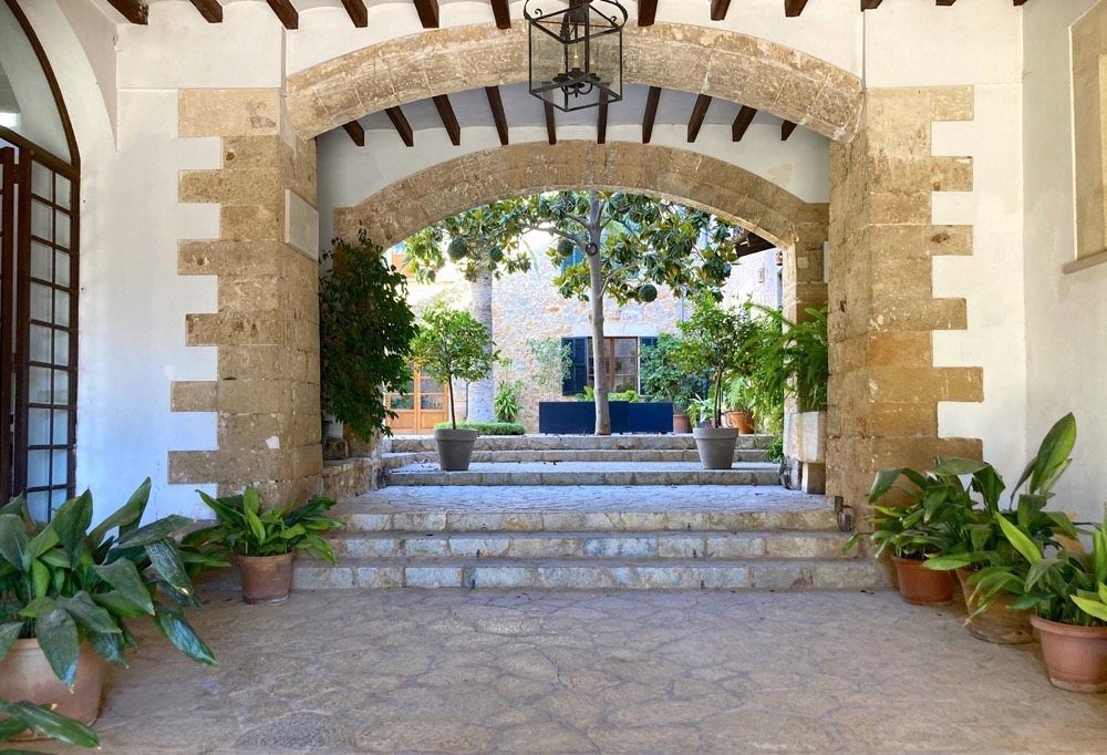 Marès stone arches opening onto the courtyard of a Mallorcan manor house