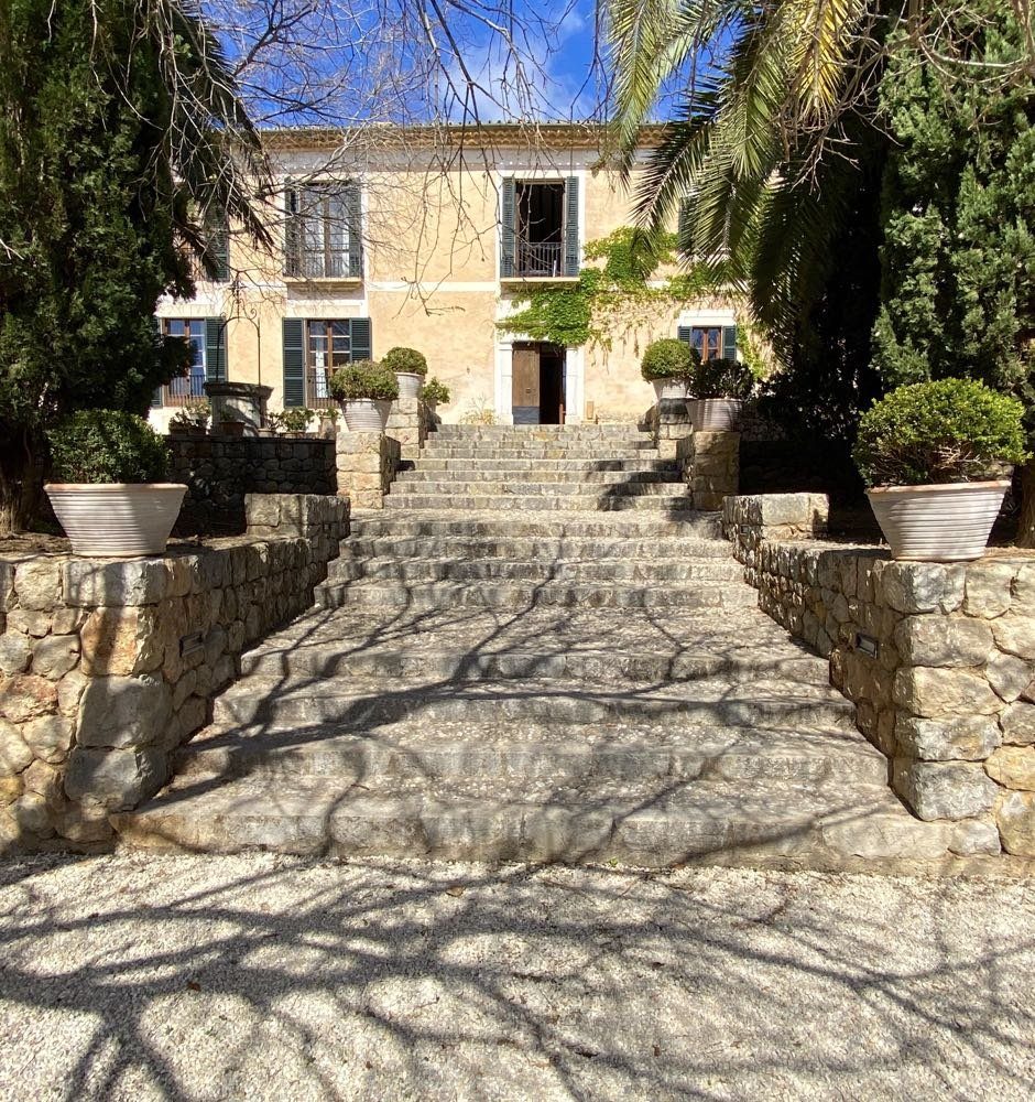 Stone staircase leading up to a historic manor house on Mallorca